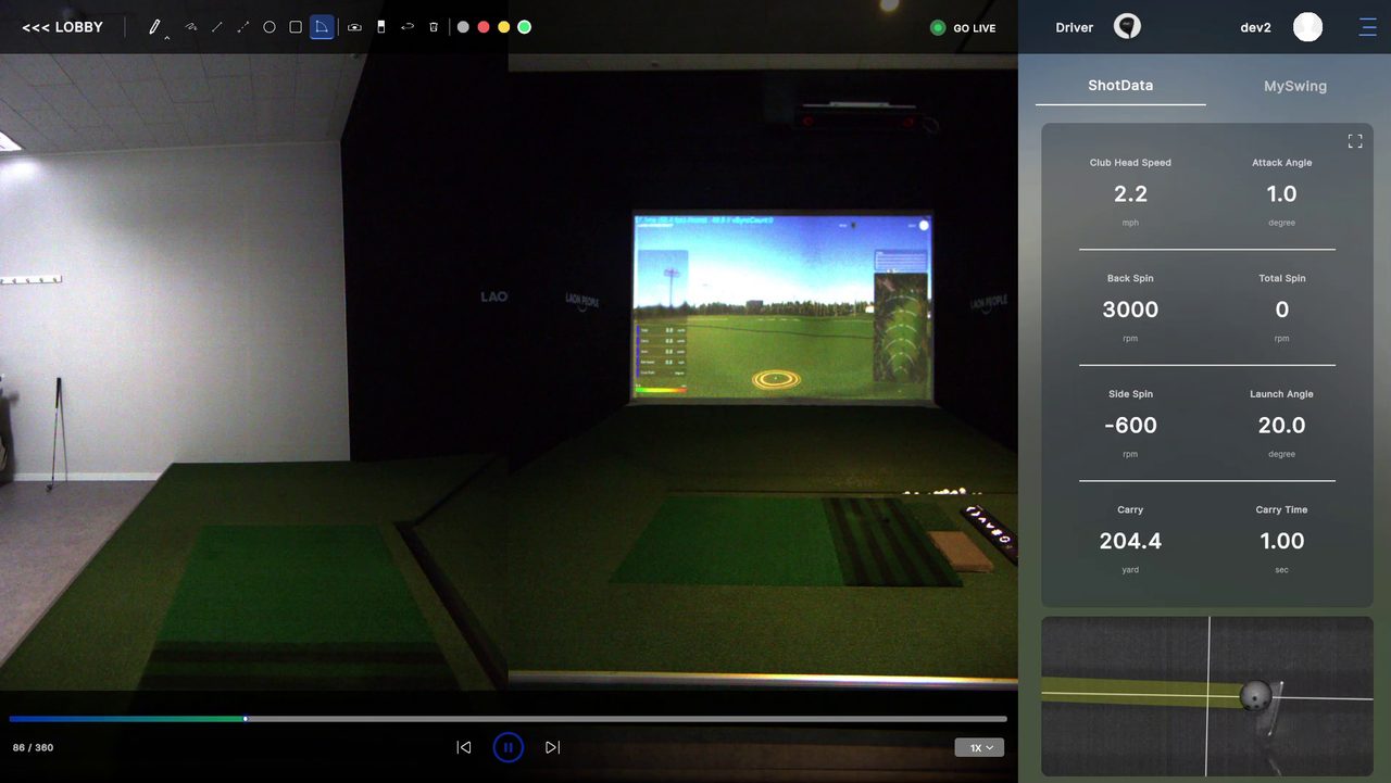 SwingEZ Range module showing synced Face-On and Down-The-Line swing replay alongside the in-sim driving range view, with the ShotData panel displaying Club Head Speed, Attack Angle, Back Spin, Total Spin, Side Spin, Launch Angle, Carry, and Carry Time